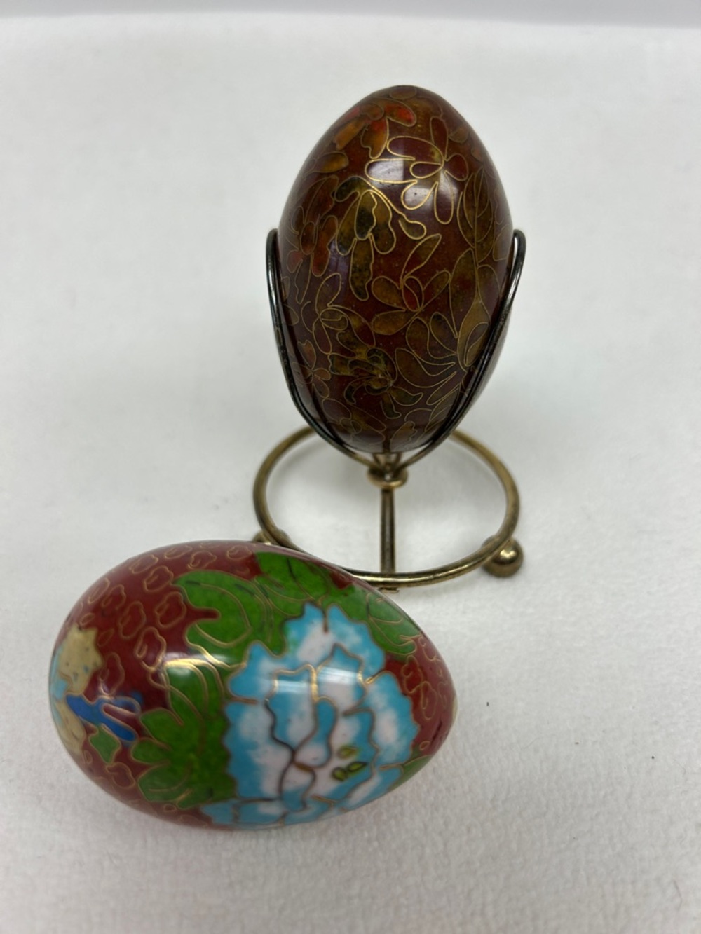 Vintage pair of cloisonné enamelled inlay brass eggs  with one brass tone stand